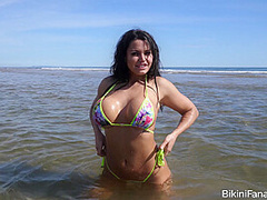Topless bikini model on the beach