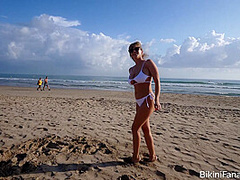 Naturally busty bikini babe on the beach