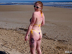 Pale chav bares it all on a public beach