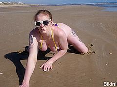 Pale chav bares it all on a public beach