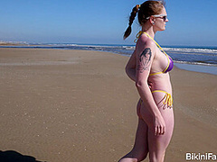 Pale chav bares it all on a public beach
