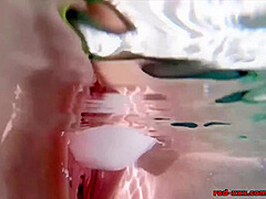 Red XXX masturbates poolside with an ice dildo