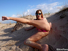 Naughty bikini model on the beach