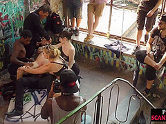 Bald slut in leather harness 3way DP fucked in public