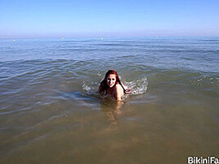 Amateur bikini model bares it all on a public beach