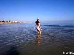 Amateur bikini model bares it all on a public beach