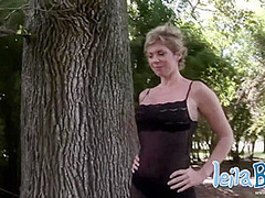 Leila Babe striptease showing her big tits outdoor tree
