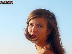 Solo erotic brunette teen with small tits poses outdoor