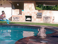 Black guy, Rob Piper is giving oral pleasure to Gia Derza, next to the swimming pool
