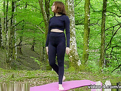 Abby does naked yoga and masturbates in the forest