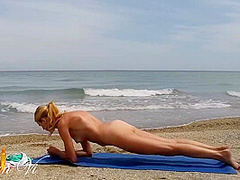 Nude Yoga Workout Of A Beautiful Blond Woman With Nice Tits And Perfect Pussy On The Beach