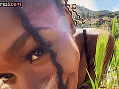 Busty Ebony babe in high heel boots fingering pussy outdoor
