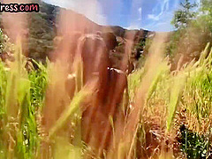 Busty Ebony babe in high heel boots fingering pussy outdoor