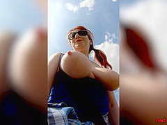 Hot MILF Red XXX goes for a topless walk on Easter