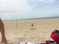 Dildo anal insertion on public beach