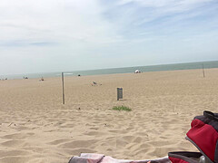 Dildo anal insertion on public beach