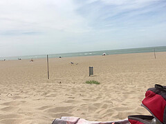 Dildo anal insertion on public beach