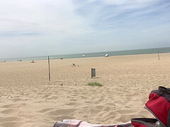 Dildo anal insertion on public beach