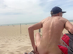 Dildo anal insertion on public beach