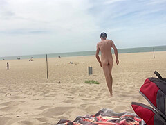 Dildo anal insertion on public beach