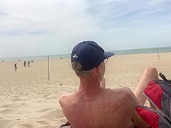 Dildo anal insertion on public beach
