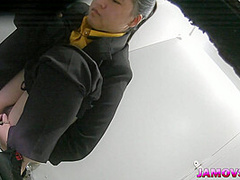 Hairly Asian teen pussy captured peeing