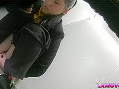 Hairly Asian teen pussy captured peeing