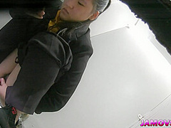 Hairly Asian teen pussy captured peeing