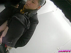 Hairly Asian teen pussy captured peeing