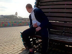 Guy Masturbates On The Promenade In The City Center