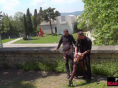 Public babe deepthroating outdoor while spanked in 3some