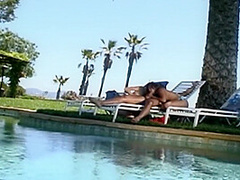 Two Stunning Babes Suckinga A Hard Cock Near The Pool