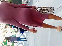Wiggle butt tall slim black woman in pink