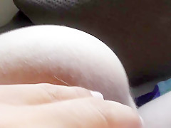 Hairy mature flashing in front of window