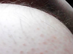 Hairy mature flashing in front of window