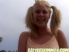 Petite teen masturbating on the beach