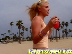Petite teen masturbating on the beach