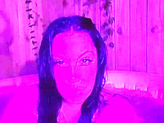 Brunnette flashing her boobs at the hot tub