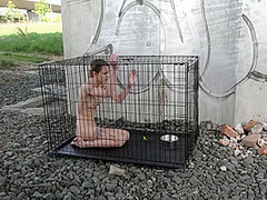 Exposed in the public pillory cage by Femdom Austria