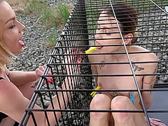 Exposed in the public pillory cage by Femdom Austria