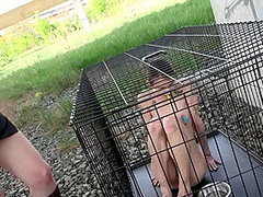 Exposed in the public pillory cage by Femdom Austria