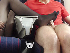 Stewardess gives nylon footjob in plane by Foot Girls