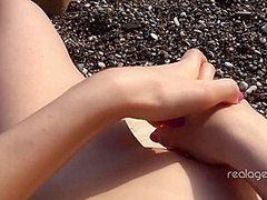 Alone lush Russian babe toys her cunt on the rock on the sea shore by Real Agent