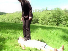 Outdoor trampling punishment with muddy shoes by Femdom Austria