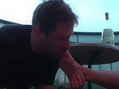 Sexy femdom smoking a cigarette while getting feet licked and toes sucked by Foot Girls