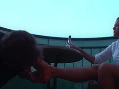 Sexy femdom smoking a cigarette while getting feet licked and toes sucked by Foot Girls