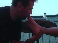 Sexy femdom smoking a cigarette while getting feet licked and toes sucked by Foot Girls