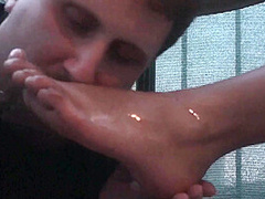 Sexy femdom smoking a cigarette while getting feet licked and toes sucked by Foot Girls