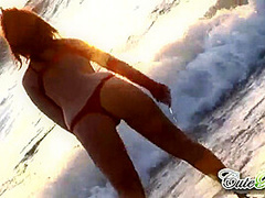 Hot babes on the beach teasing the camera