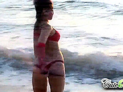 Hot babes on the beach teasing the camera